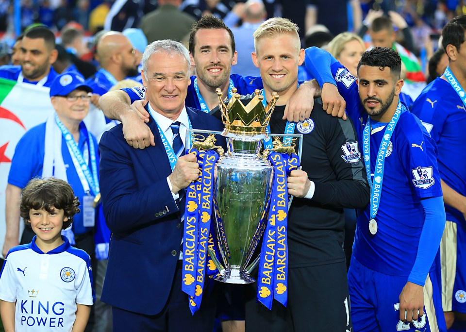 Leicester boss Claudio Ranieri celebrates with the Premier League trophy