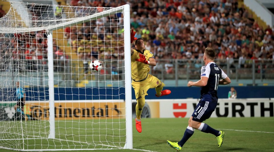 Hogg dives in vain as the cross from Scotland's Robert Snodgrass goes directly in to the goal during the 2018 FIFA World Cup Qualifying match