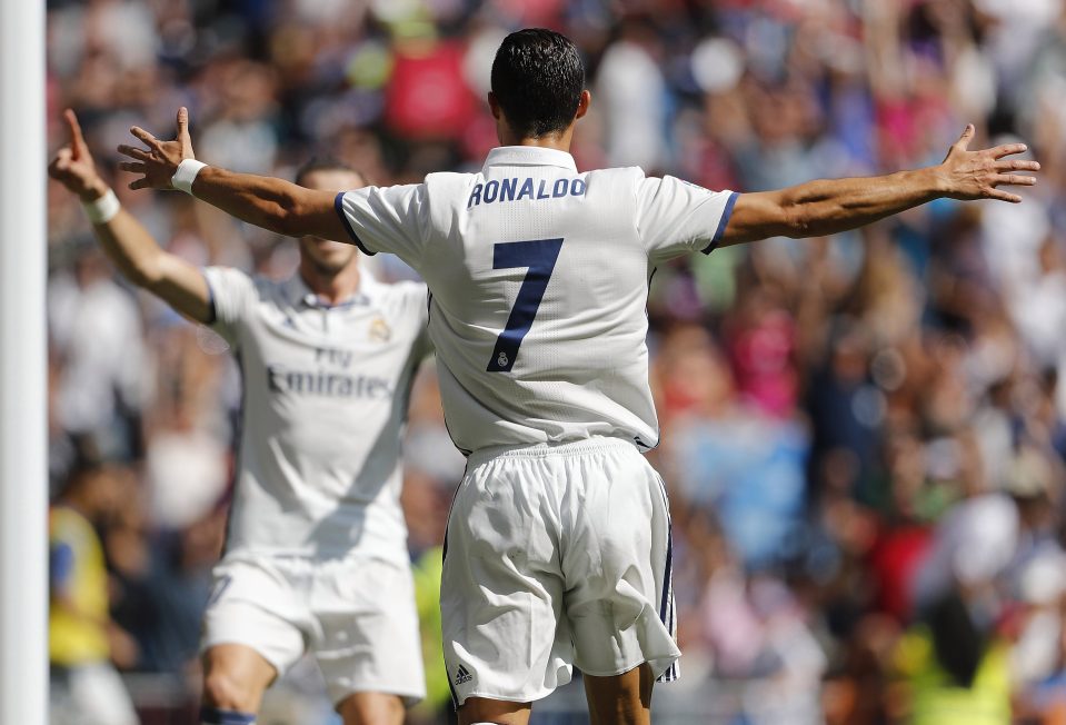 MADRID, SPAIN - SEPTEMBER 10: Cristiano Ronaldo (R) of Real Madrid celebrates with Gareth Bale after scoring the opening goal during the La Liga match between Real Madrid CF and CA Osasuna at Estadio Santiago Bernabeu on September 10, 2016 in Madrid, Spain. (Photo by Angel Martinez/Real Madrid via Getty Images)