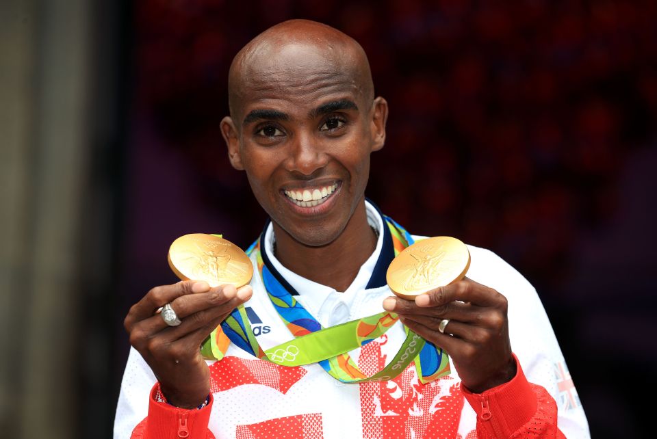  Mo Farah posing with his two gold medals after winning the 5000m and 10000m