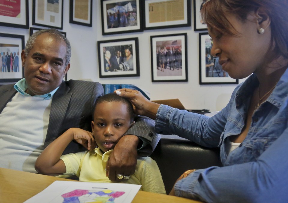  Raphael and Maribel Martinez comfort their son Andy after a press conference at their lawyer's office