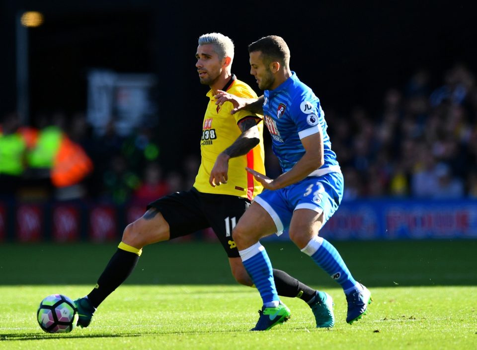  Wilshere challenges Valon Behrami of Watford for the ball