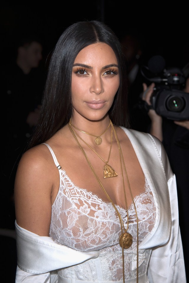  Kim Kardashian was pictured just hours before the terrifying raid at Paris Fashion Week's Givenchy show - in which her sister Kendall Jenner was modelling