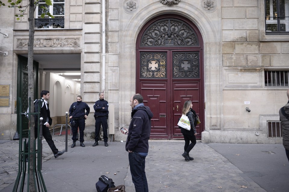  Police pictured outside the luxury Paris apartment where Kim was robbed at gun point