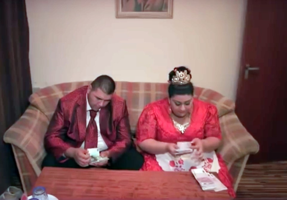 The couple counted their cash in a 'business-like manner' after the wedding 