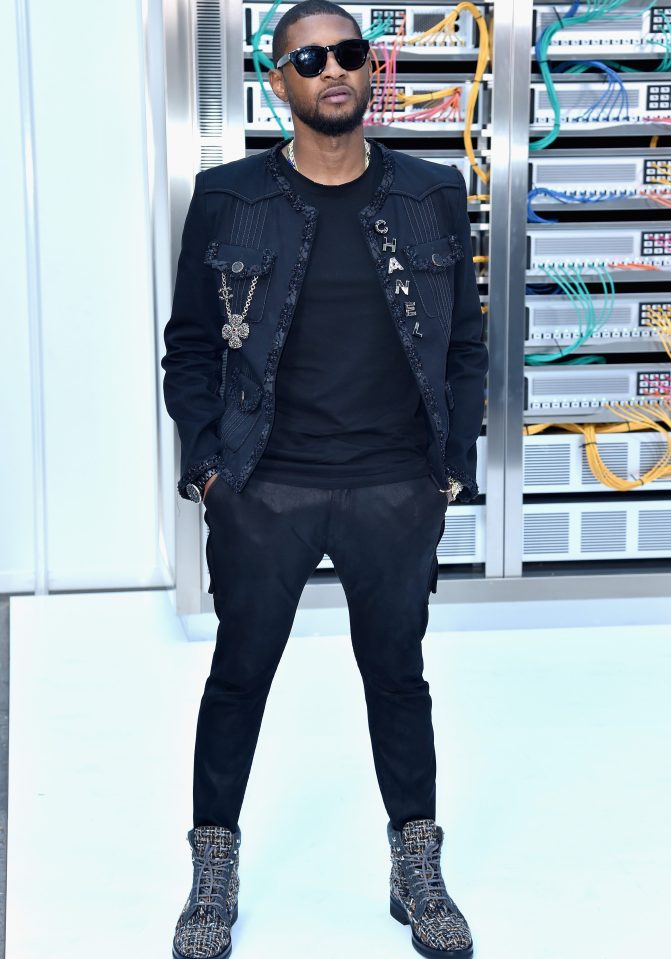  Usher looked casual in an all black outfit and signature sunglasses