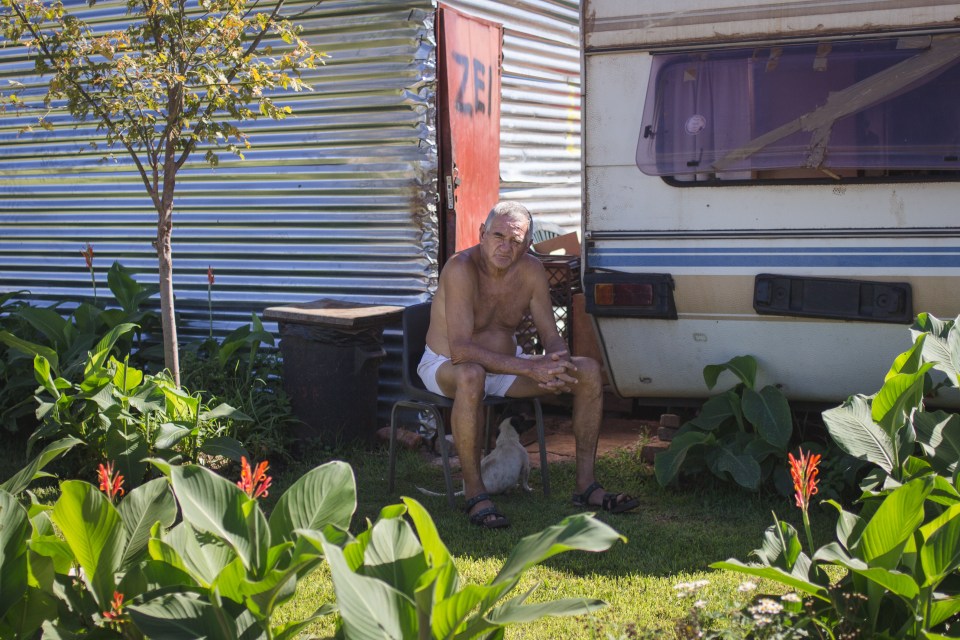  Pierre Potgieter sits in his garden. Pierre spends most of his free time tending his garden. He lives off of his state pension