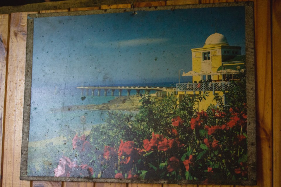  A picture Sussana Roos found in the dumpsite adorns the wall of her wooden house in Munsieville