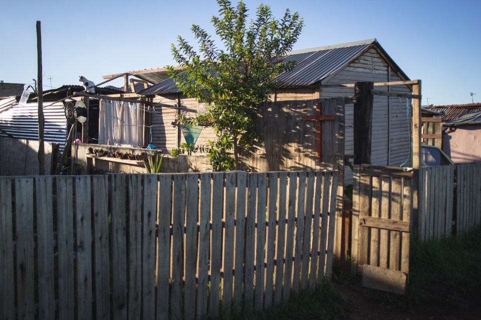  Pictured is one of the many self constructed wooden homes in the Munsieville white squatter camp