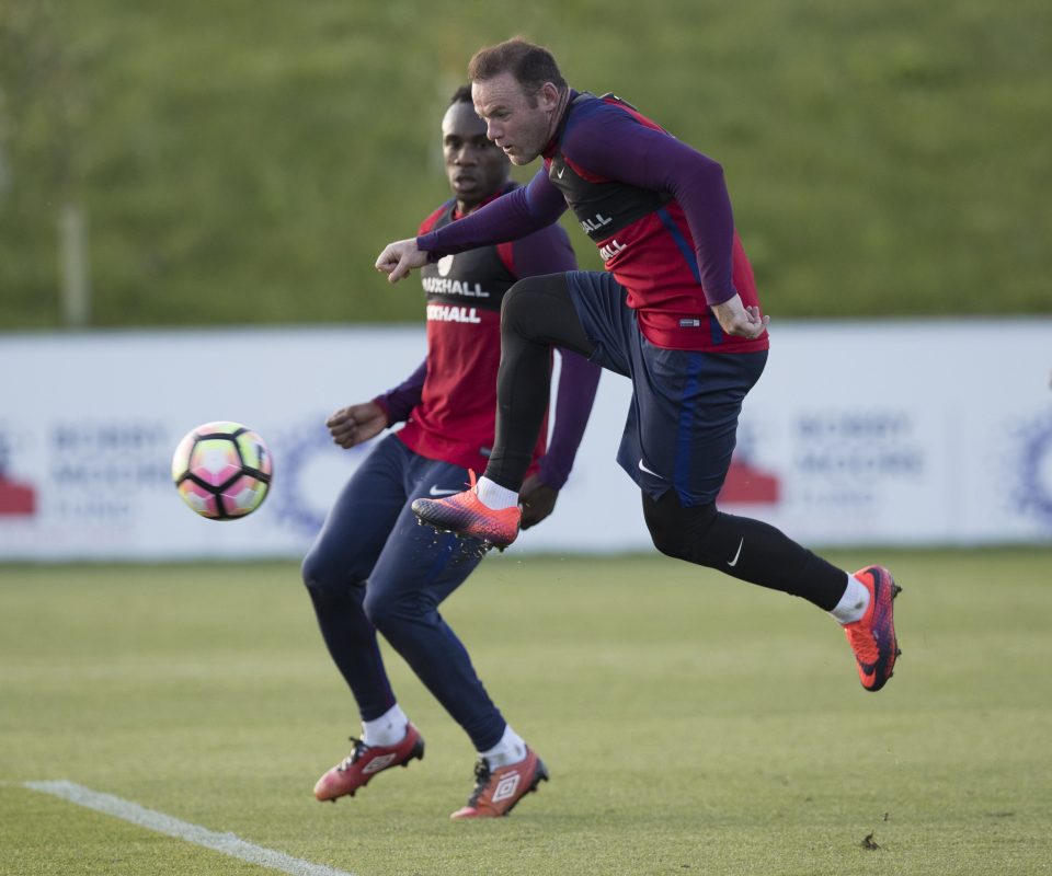 Wayne Rooney has a kick at a pass