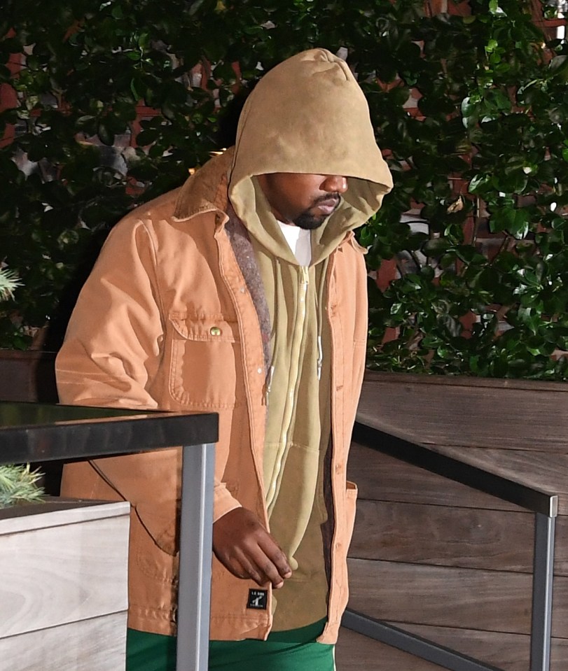 Kanye West leaves his apartment in New Y