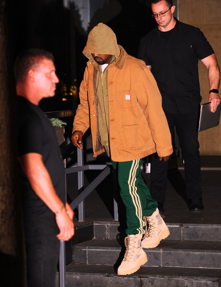 Kanye West emerges from hiding after comforting his wife Kim Kardashian after the $11 million robbery in Paris.