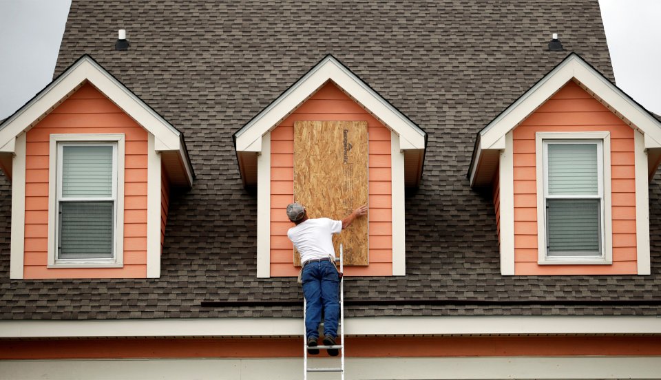  A man boards up his home in South Carolina in anticipation of Hurricane Matthew's arrival