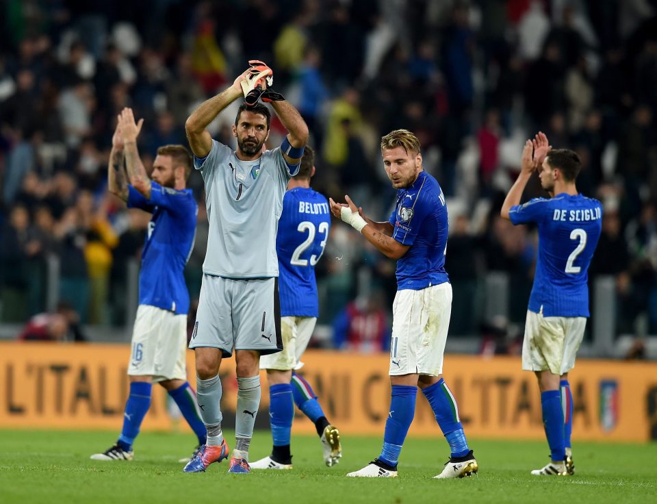 The Italian players clap their fans after an entertaining 1-1 draw with Spain tonight in Turin