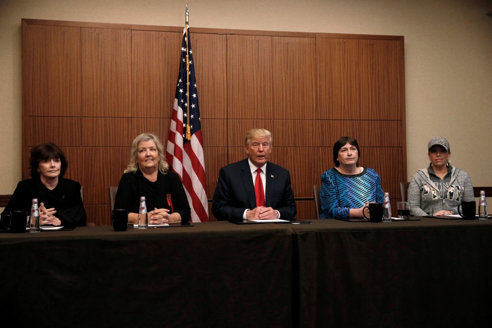 Republican presidential nominee Donald Trump sits with (from right to left) Paula Jones, Kathy Shelton, Juanita Broaddrick, Kathleen Willey in a hotel conference room before the second presidential debate 