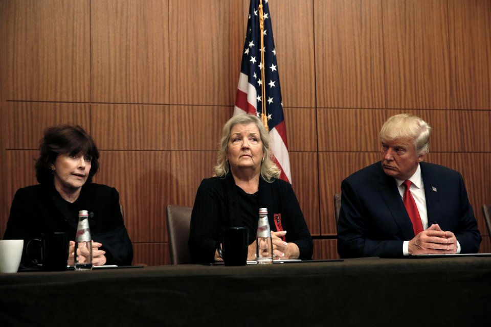 Republican presidential nominee Donald Trump sits with Juanita Broaddrick, (C) and Kathleen Willey (L) 