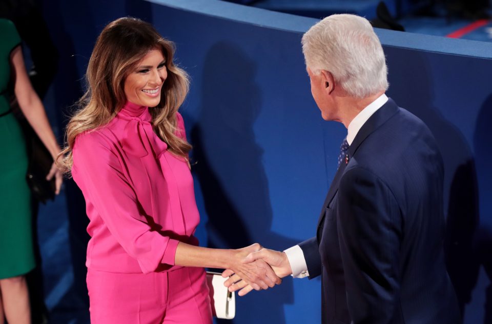 Melania Trump shakes hands with Bill Clinton at the start of tonight's TV debate