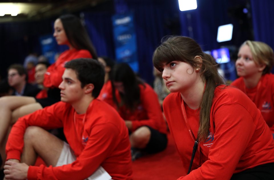 Volunteers in the media centre watch the second presidential debate 