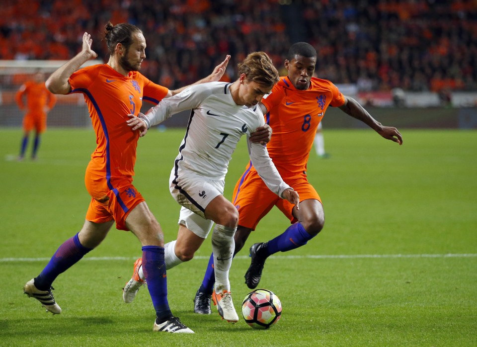  Anotine Griezmann of France takes on Georginio Wijnaldum and Daley Blind of Holland in their World Cup qualifying clash in Amsterdam