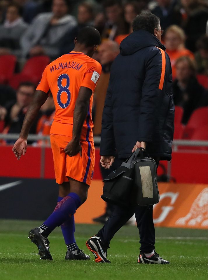  Georginio Wijnaldum holds his hamstring as he limps out of Holland's clash with France in Amsterdam