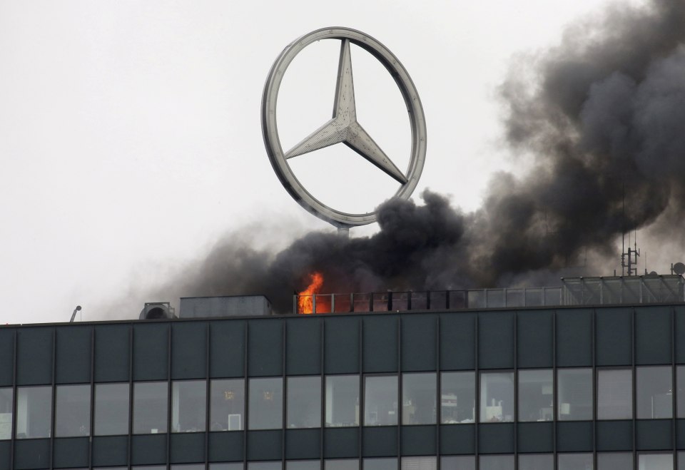  About 60 firefighters are tackling the blaze at the west Berlin landmark