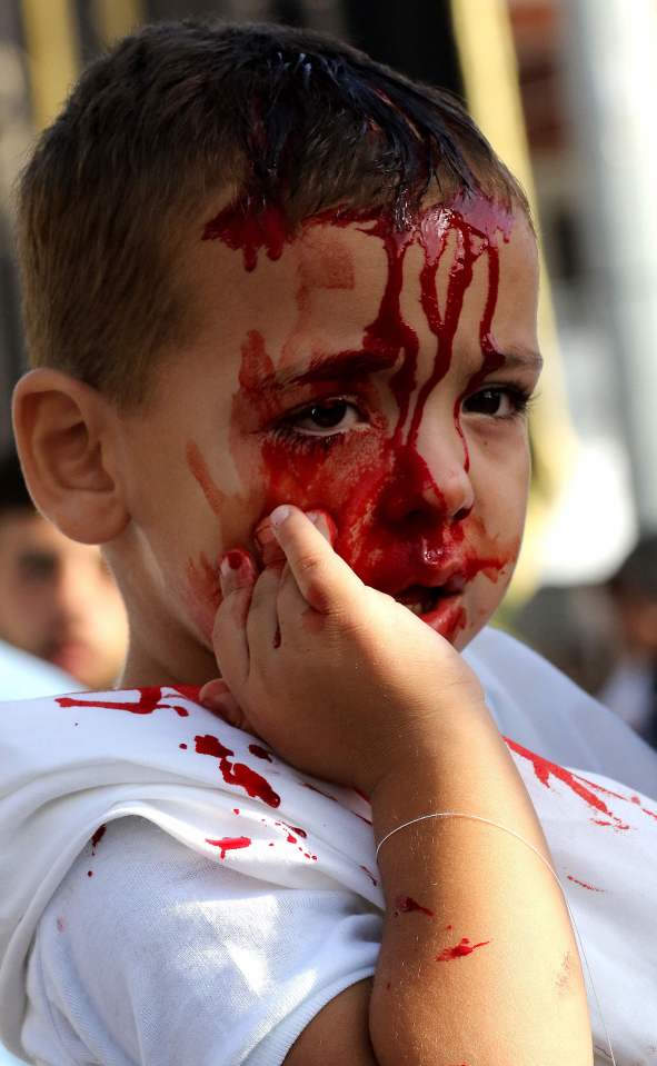  A Lebanese Shiite Muslim boy pictured with blood running down his face during the ceremony