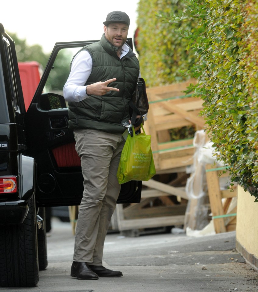  Tyson Fury steps out of his jeep with a bag of snacks after his suspension from boxing