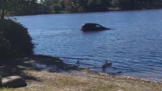  Terrifying moment car is spotted after careering into icy pond