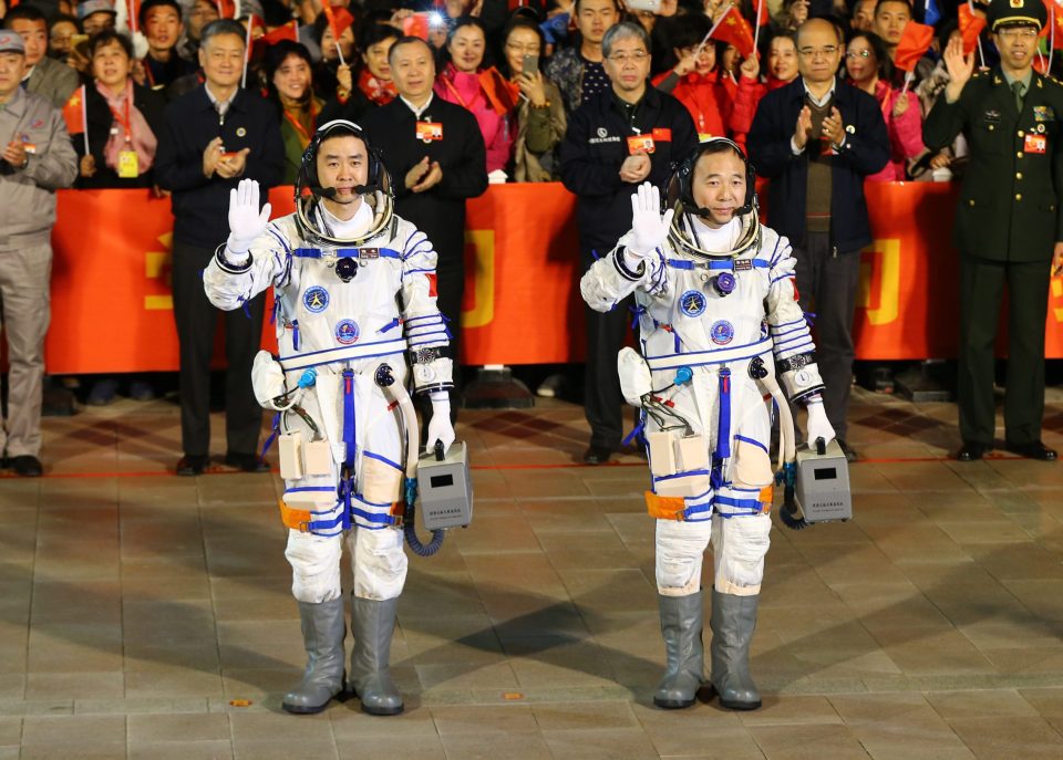 Chinese astronauts Jing Haipeng and Chen Dong during a ceremony prior to launch