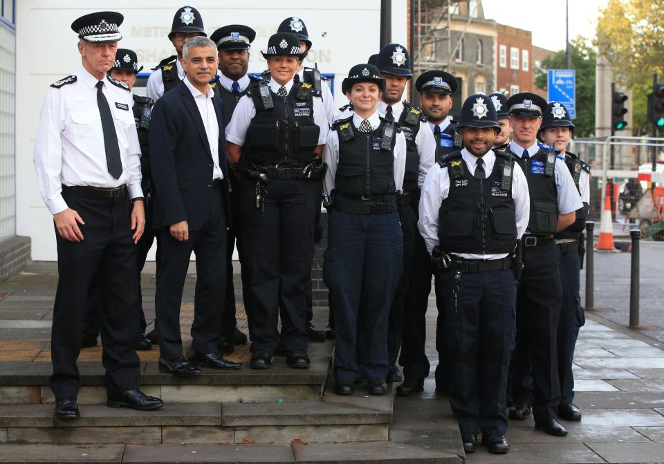 Khan - pictured with officers in South London - said the technology brought the force 'into the 21st century'