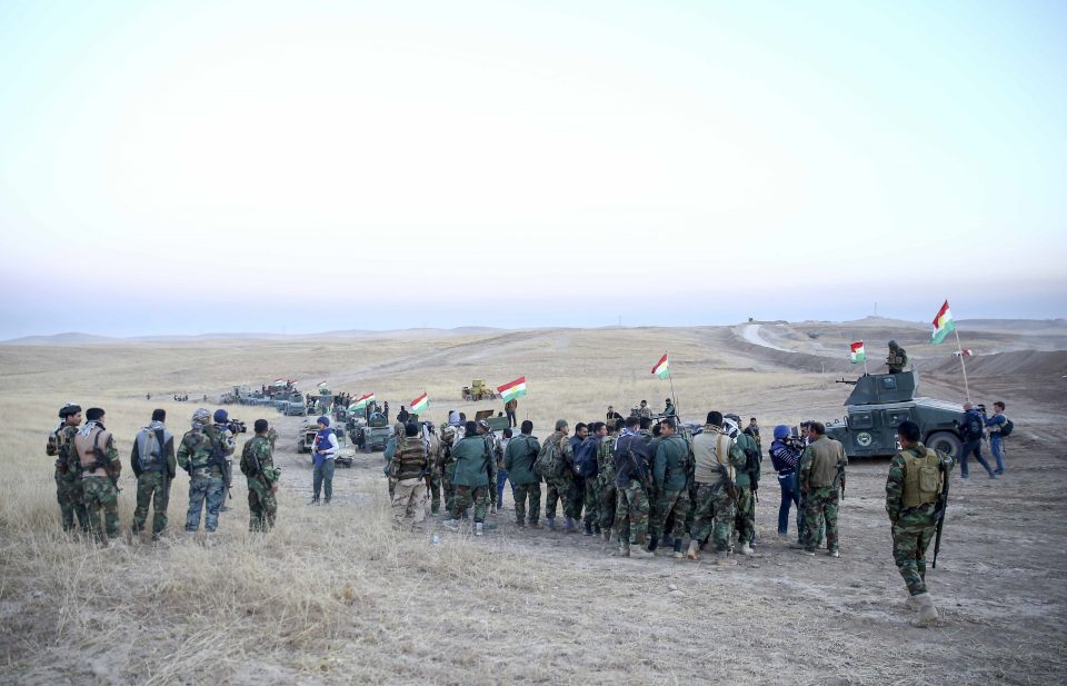 Peshmerga forces stand guard at Hazer region's Wardak village this morning