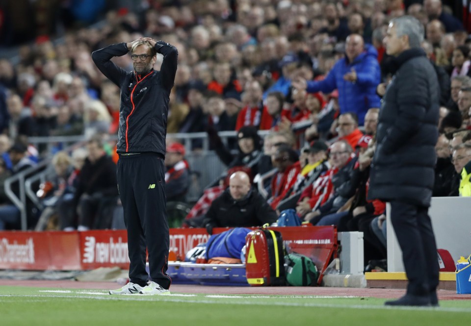  Jurgen Klopp reacts on the touchline as his opposite number Jose Mourinho watches on