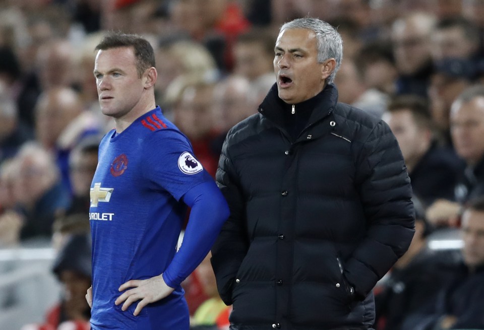  Jose Mourinho watches on as Wayne Rooney gets ready to come on at Anfield