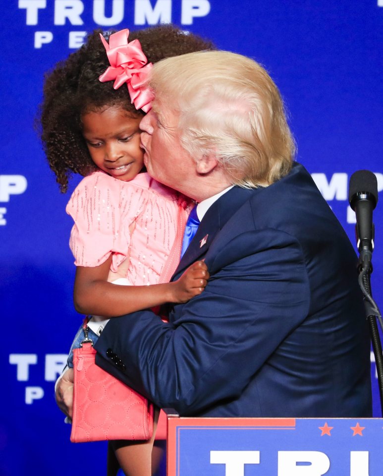 The Republican candidate had pulled the "beautiful" little girl up on stage after picking her out from the crowd