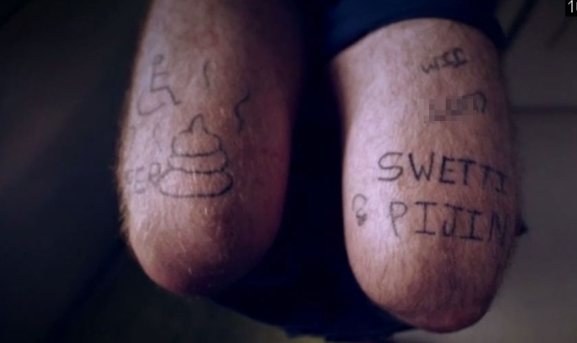 Tom's legs were inked with random words and obscenties