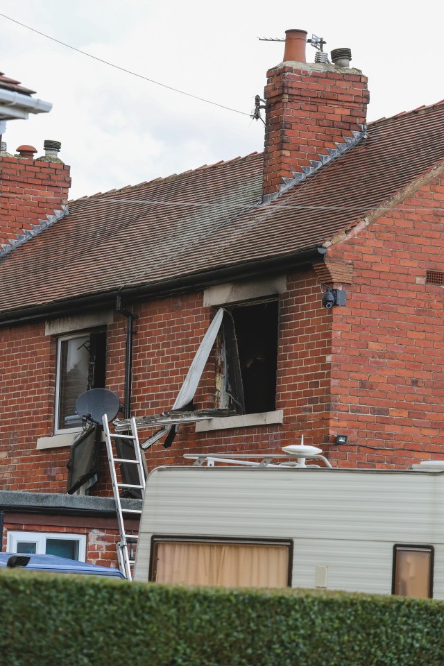  Police are examining the home at Ash Crescent in Wakefield after the fatal fire