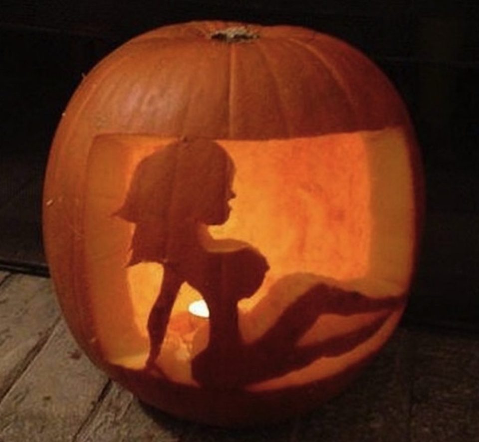 A stripper is carved into one Halloween lantern 