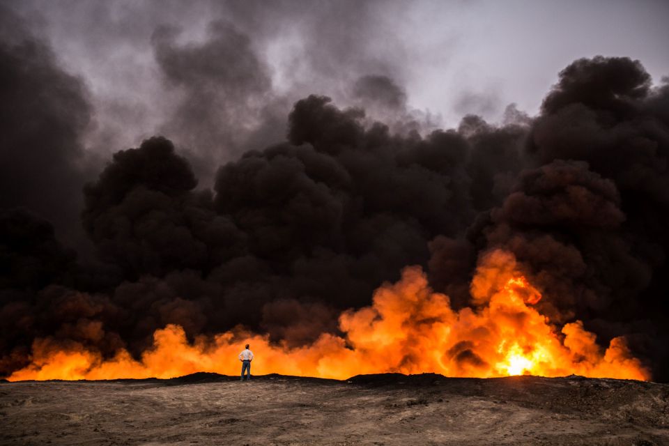  A huge blaze sparked by oil well fires burns near Mosul