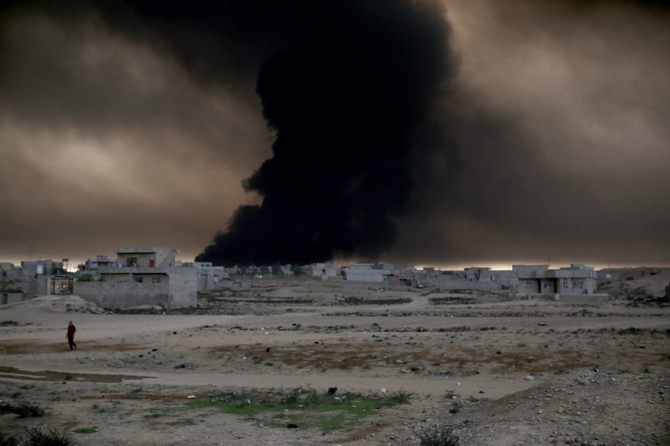  Smoke rises from oil wells across the small towns neighbouring Mosul