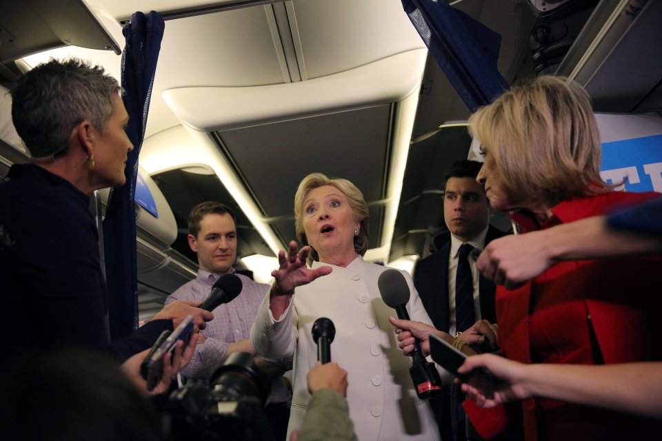 Democratic U.S. presidential candidate Hillary Clinton talks to the media inside of her campaign plane after the third and final 2016 presidential campaign debate in North Las Vegas