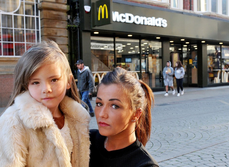 Kayley and Jordyn outside the McDonald's where they found the syringe