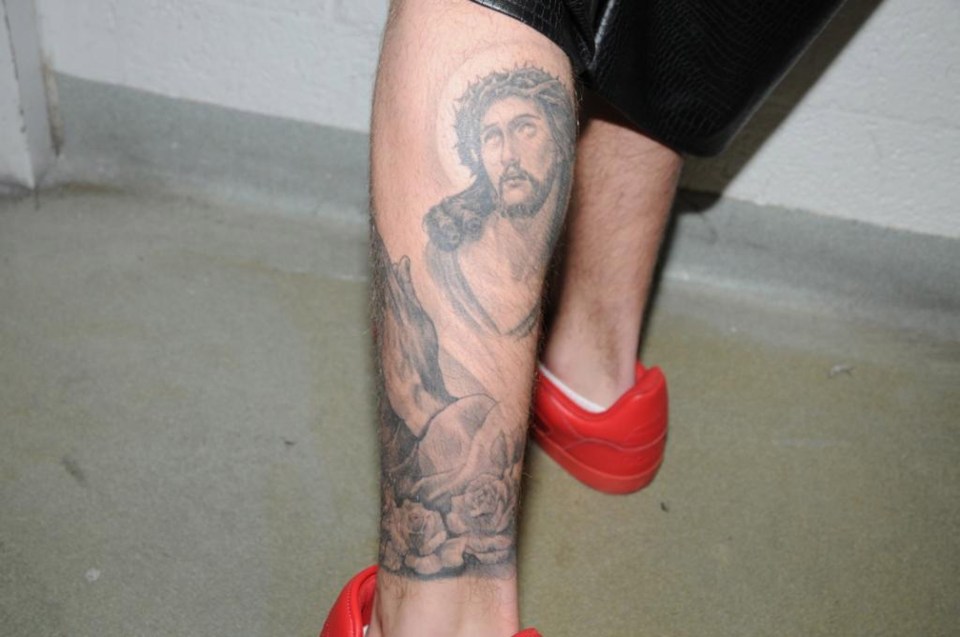  We're not sure this religious portrait is very appropriate for the back of the leg