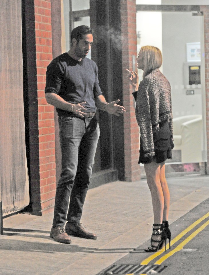  The pair looked deep in conversation as they smoked outside a restaurant