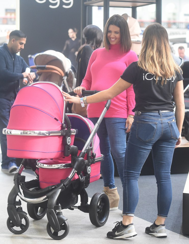  Rebekah Vardy gets chatting to the shop assistant while she searches for a pram