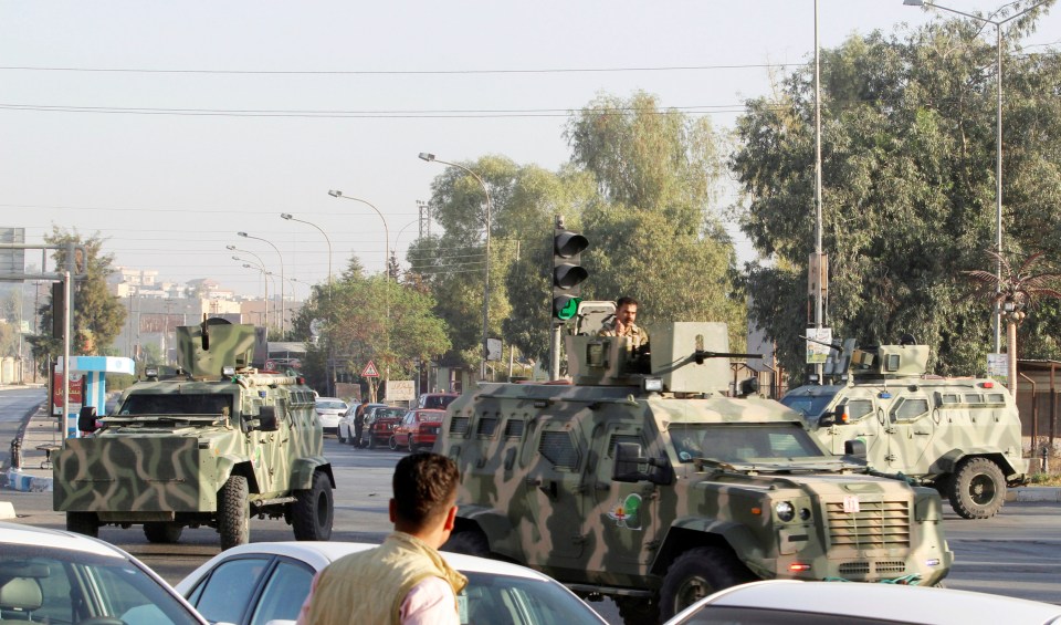  Military vehicles of peshmerga forces are seen at a site of an attack by Islamic State militants in Kirkuk, with the jihads driven back