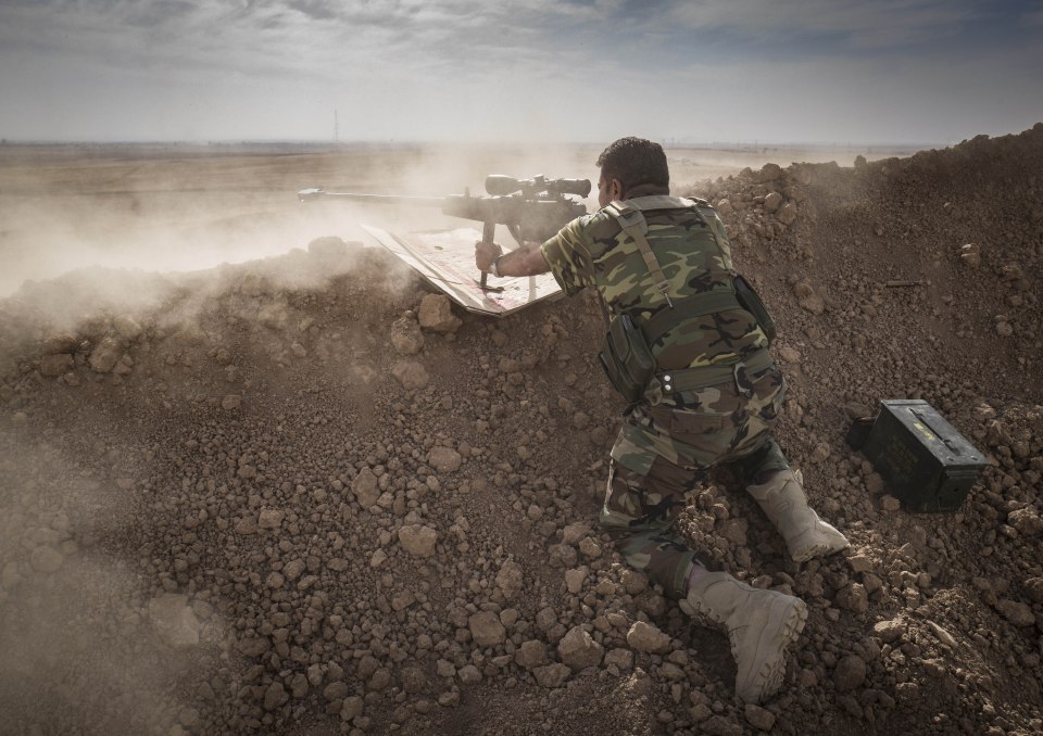  An Iraqi Army sniper takes aim during a skirmish near Mosul