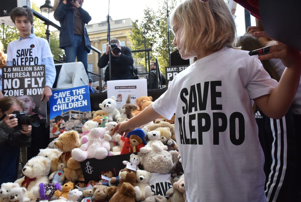  Children dressed in 'Save Aleppo' t-shirts brought along teddied