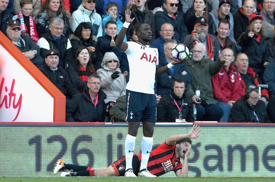 Moussa Sissokho protests his innocence as Harry Arter holds his face