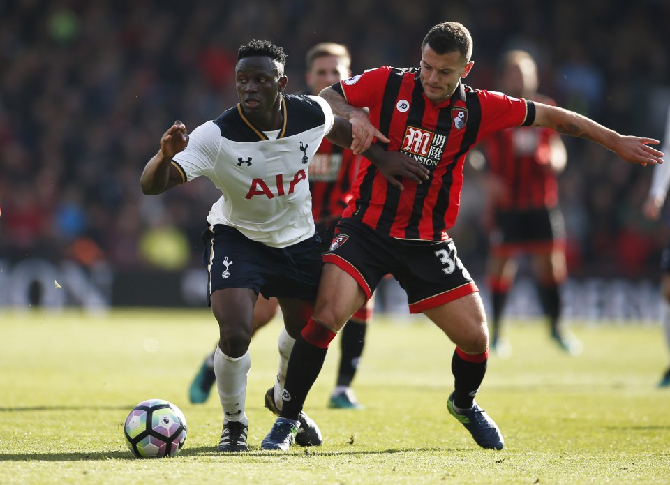 Wilshere was snuffled out by the excellent Spurs marshal Victor Wanyama (l)