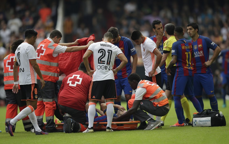 FC Barcelona's Andes Iniesta lies on the pitch after an injury during the Spanish La Liga soccer match between Valencia and FC Barcelona at the Mestalla stadium in Valencia, Spain, Saturday, Oct. 22, 2016. (AP Photo/Manu Fernandez)